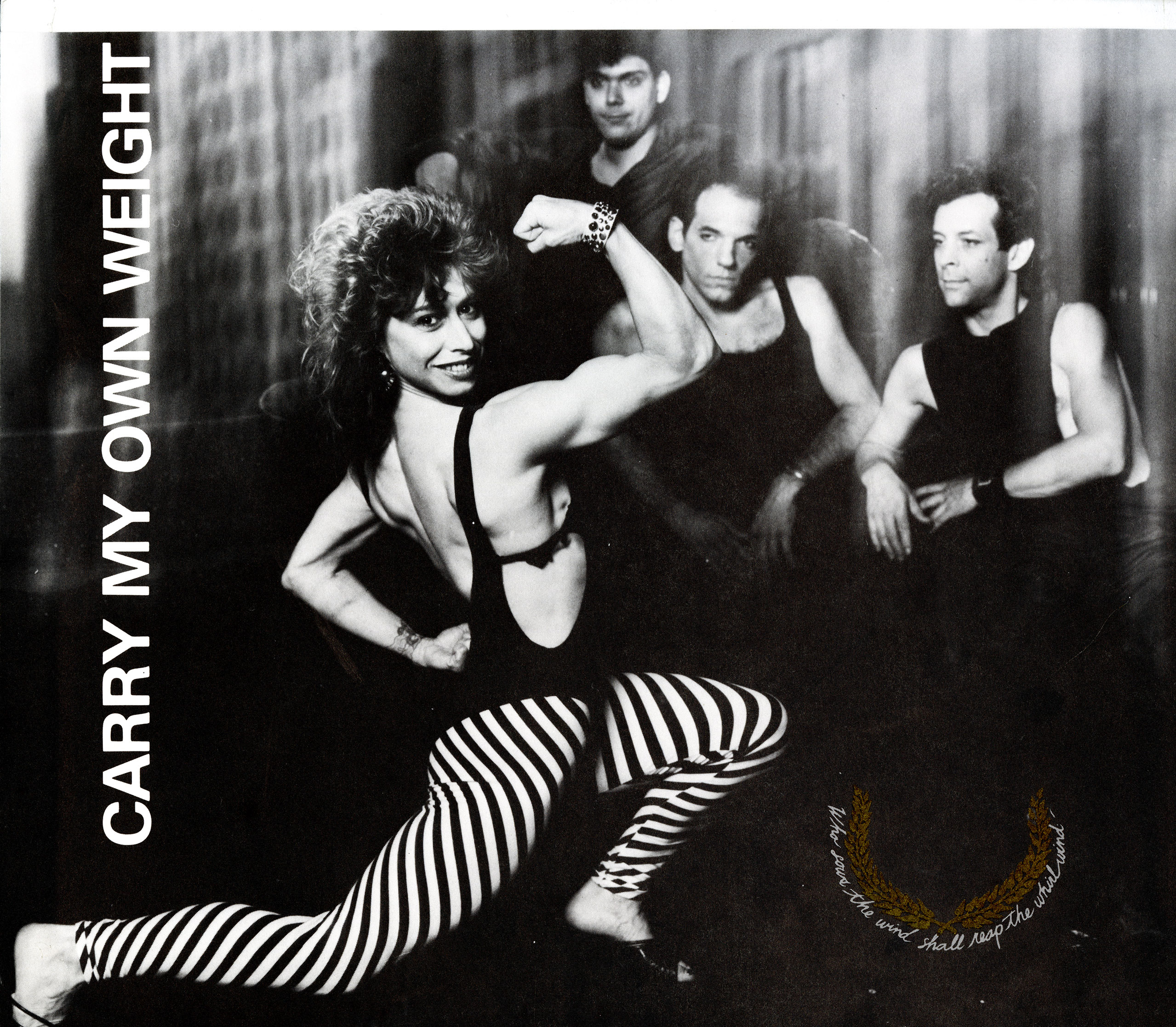 woman in leotard smiling and showing her muscles